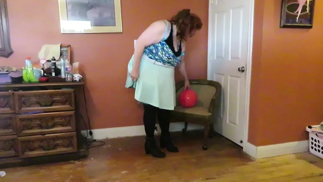 Nurse Vicki  plays with a rubber ball in a mini skirt, sexy stockings and high heel mini boots