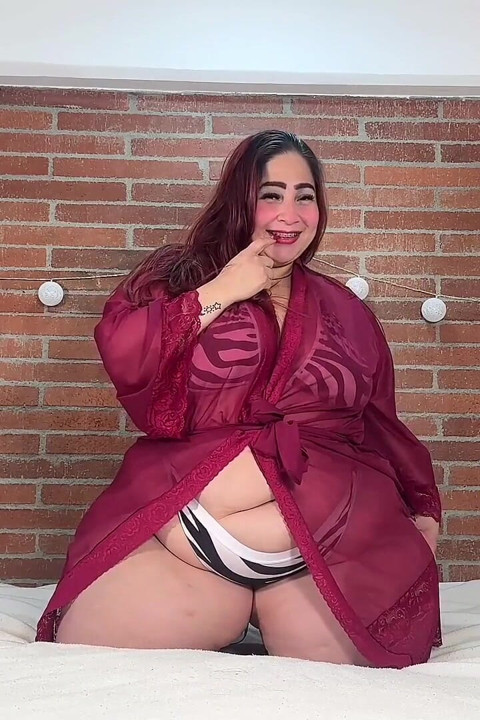 Plus-size Woman with Lush Curves in Zebra Lingerie: Provocative and Sensual in Bed