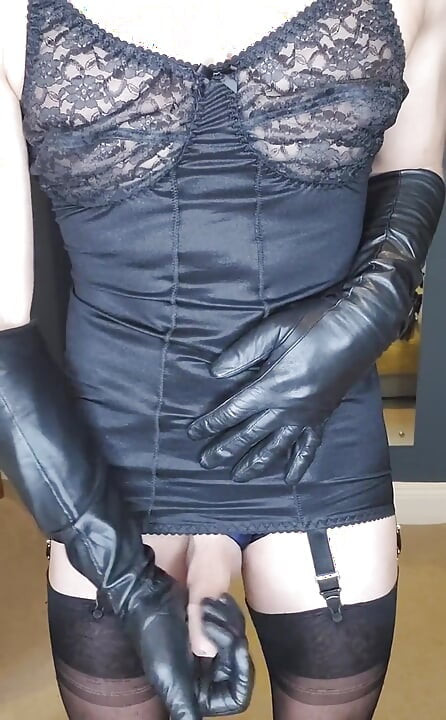 Am I making you horny sliding on my long leather gloves and teasing in my black corsellete and fully fashioned stockings? Soo we