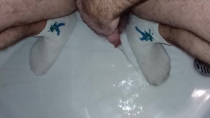 My uncut soft cock piss on my whit socked feet