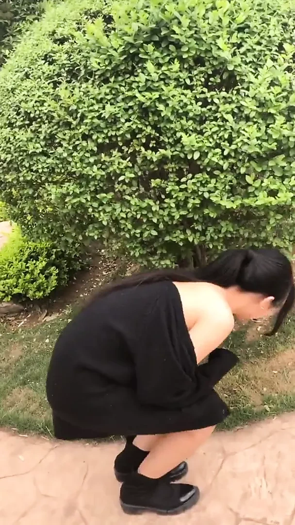 Chinese Girl Walking in a Park