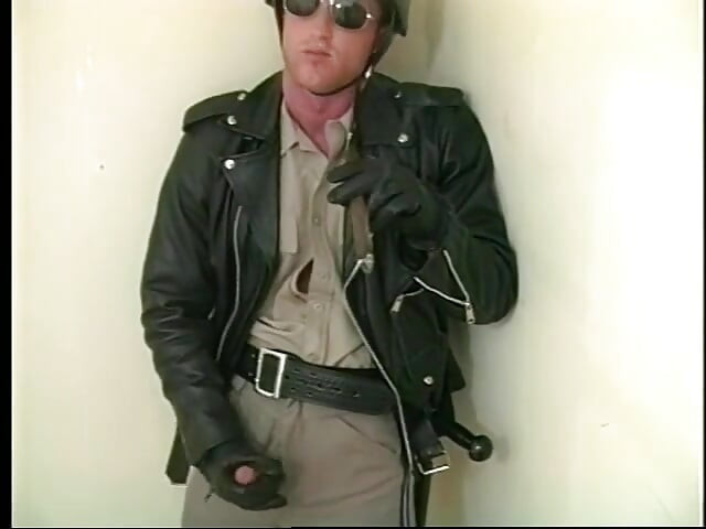 Muscular homo stud in police uniform rubs his cock