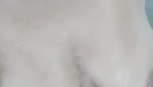 Hot mature woman relaxes in the bathroom and masturbates full of foam under the shower