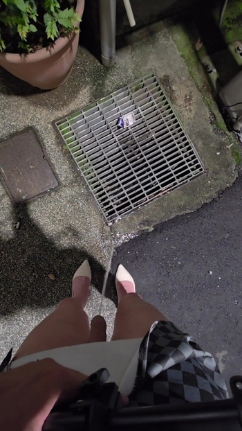 Key moment from "Shemale Ting xuan walks outside to pee, then masturbates and cums on her thigh."