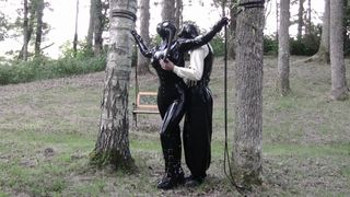 Bizarre Beauty - Latex and bondage during garden party
