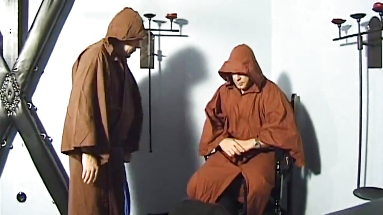 Bound Cougar Teased Relentlessly by Two Hooded Men