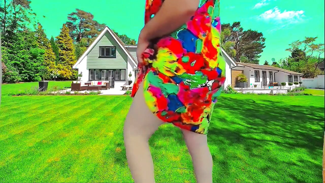 Sweet shemale walking through garden in summer breeze