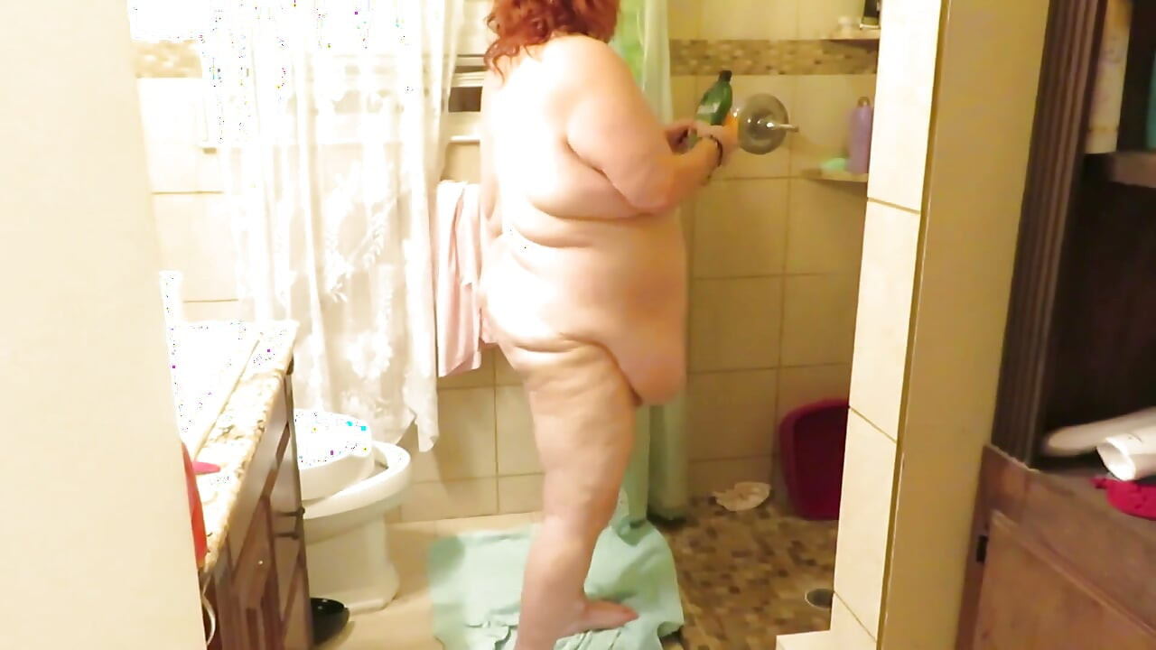 Step mom cleaning bathroom thinks of her step son watching