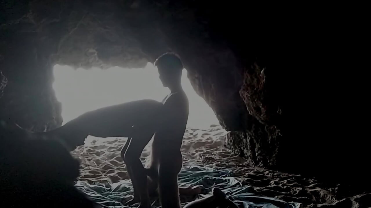 Couple recorded at the beach, inside the cave