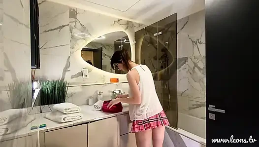 Long legs nerdy college girl with a short skirt and panties shows off in the bathroom