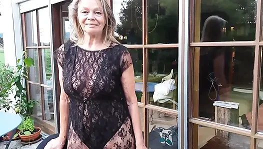 A Mature Woman Shows off Her Figure Outside in a Lace Bodysuit!