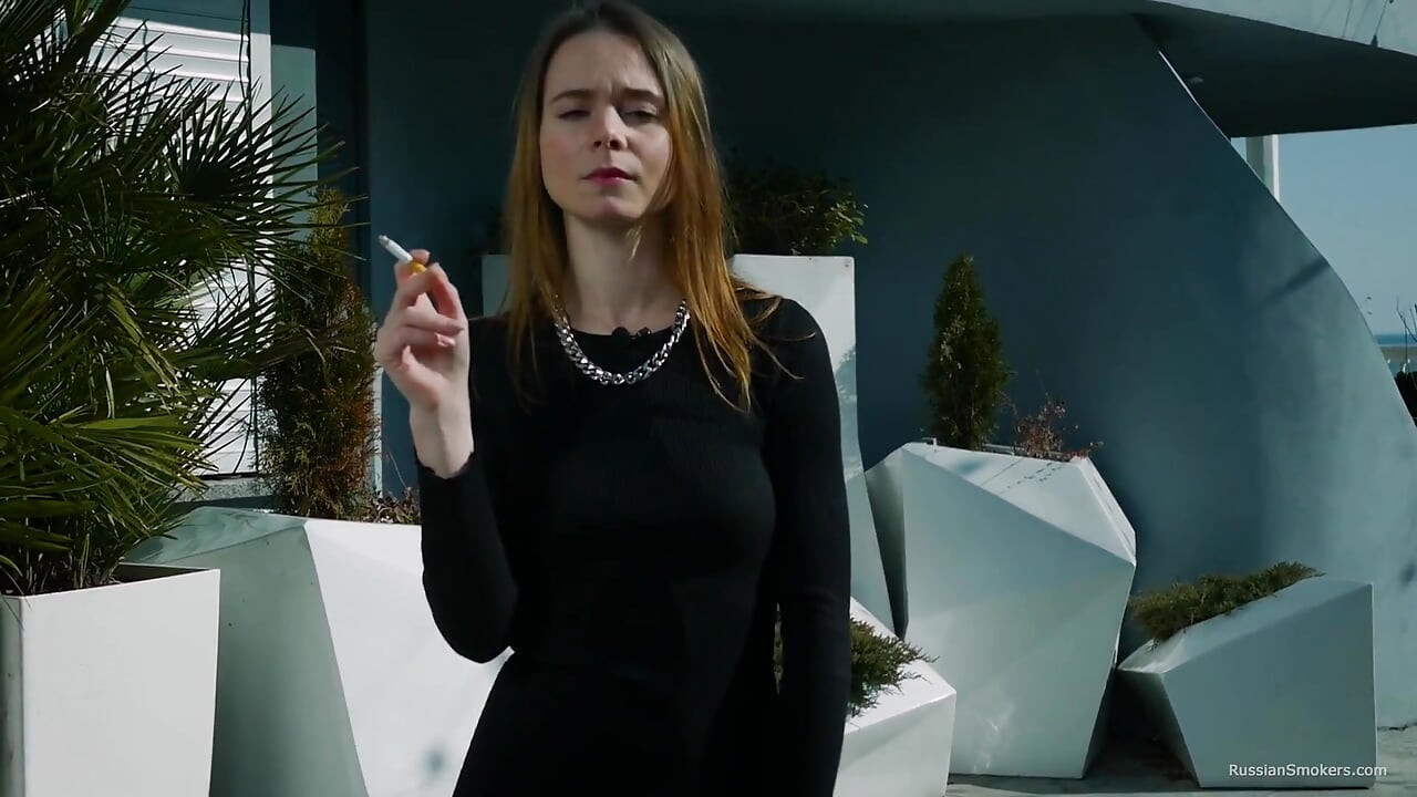 Young Russian Girl Smoking Cigarette by Seaside