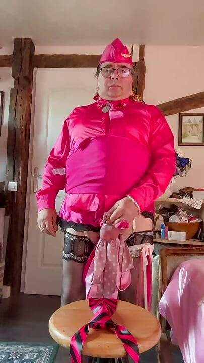 In a fuchsia flight attendant outfit to enjoy on the fuchsia and black tie