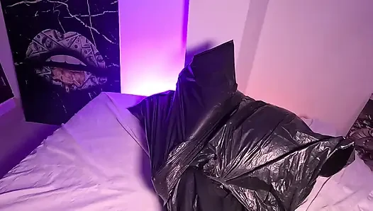 Girl in Garbage Bag Plays with Her Breath