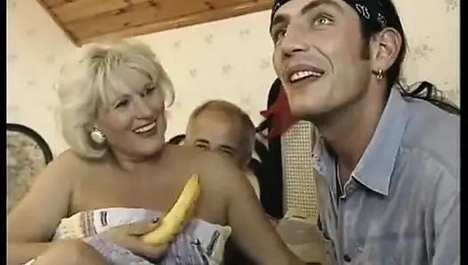 Hairy blonde mature gets spitroasted in a threesome