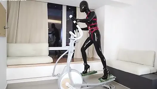 Mz27 - a Girl Bound in Latex Walks on a Treadmill