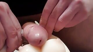 c4 - mini sex doll takes a facial ejaculation while lying on her back