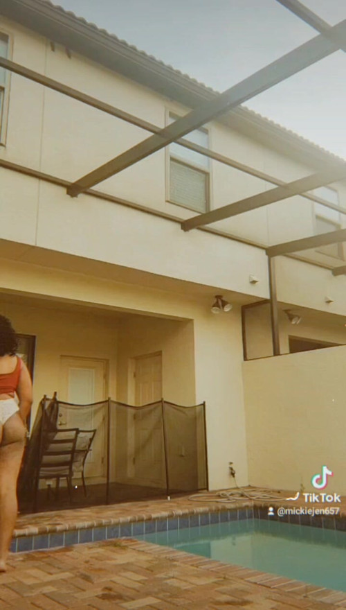 Ebony Ts Mickie walks by pool