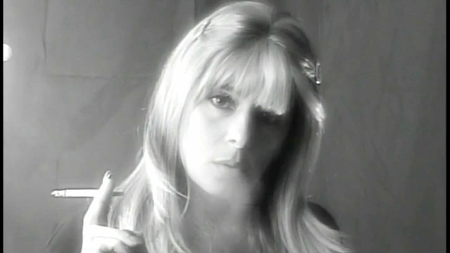 Lovely blonde smokes seductively