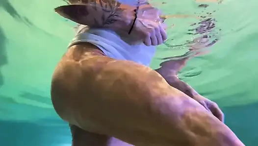 Amazon Kandy Flexes Her Massive Biceps in Her Hotel Pool