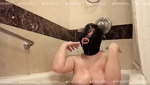 Naked Asian teen licking and playing lotion in tub