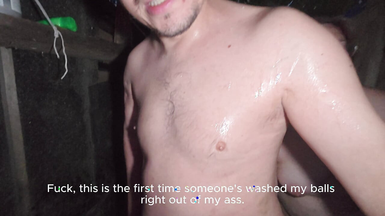 Soapy naked bodies in a rural shower