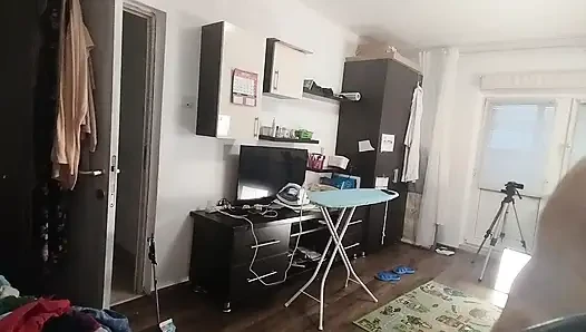 Sexy brunette doing naked chores around the house.