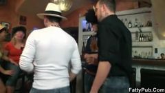 Fat chicks have fun with three guys in the bar