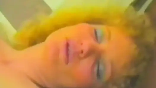 A Blonde in Stockings Jerks off with Two Dildos