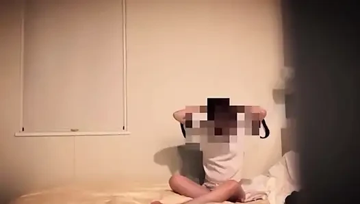 Japanese masturbating in a room