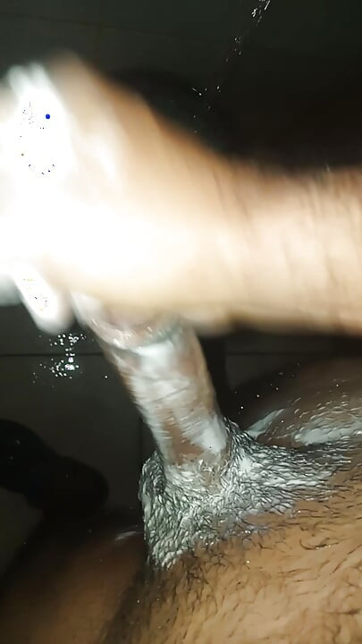 Guy in the shower soaps and masturbates by taking milk out of penis