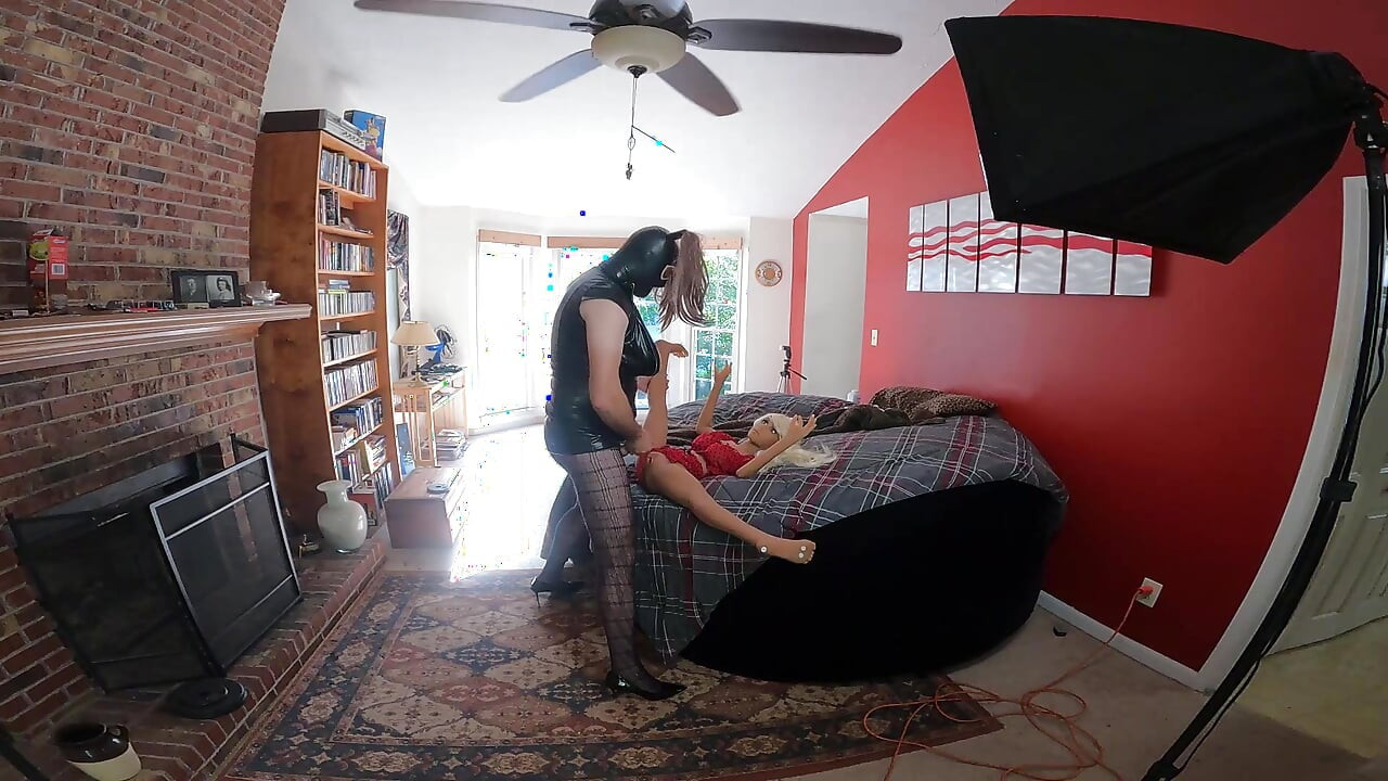 Big fake tits cross dresser fucks sex doll in front of open window