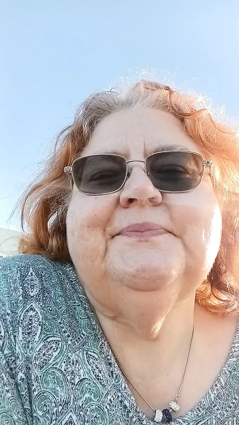 Bearded Lady try's to  lights  on windy beach!