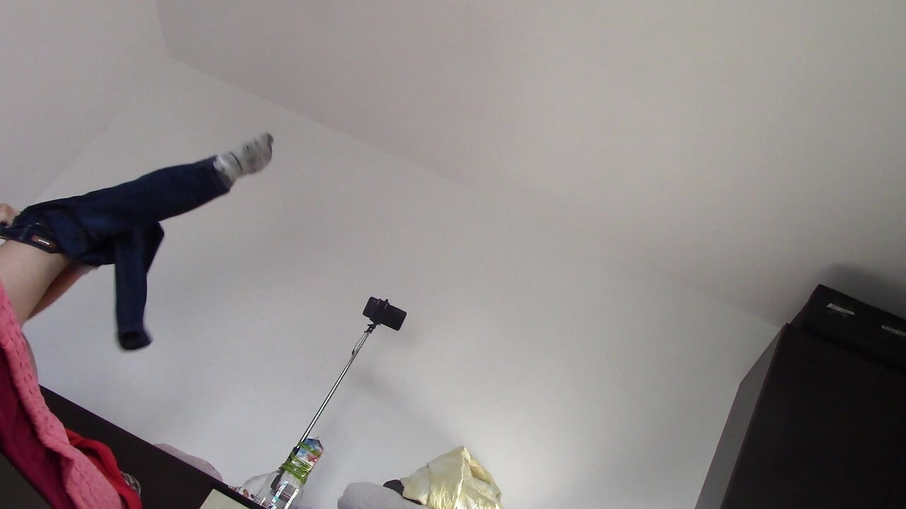 Amateur wife dancing naked at home. Amateur woman has fun trying on clothes and cutting them.
