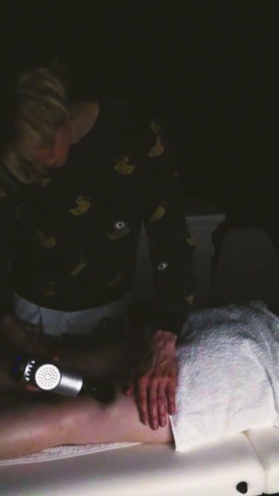 body and foot massage with a massage gun and hands | Clip 2