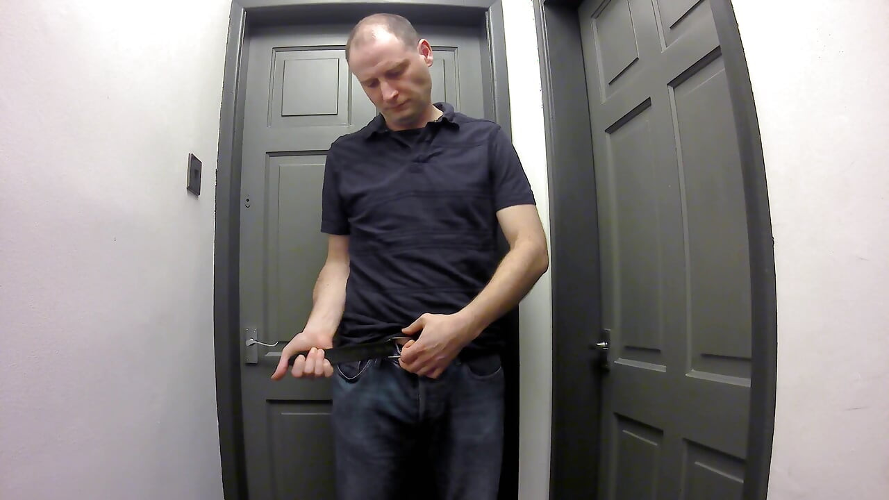 Jonathan gets out his erect shaved uncut cock as he strips naked masturbating