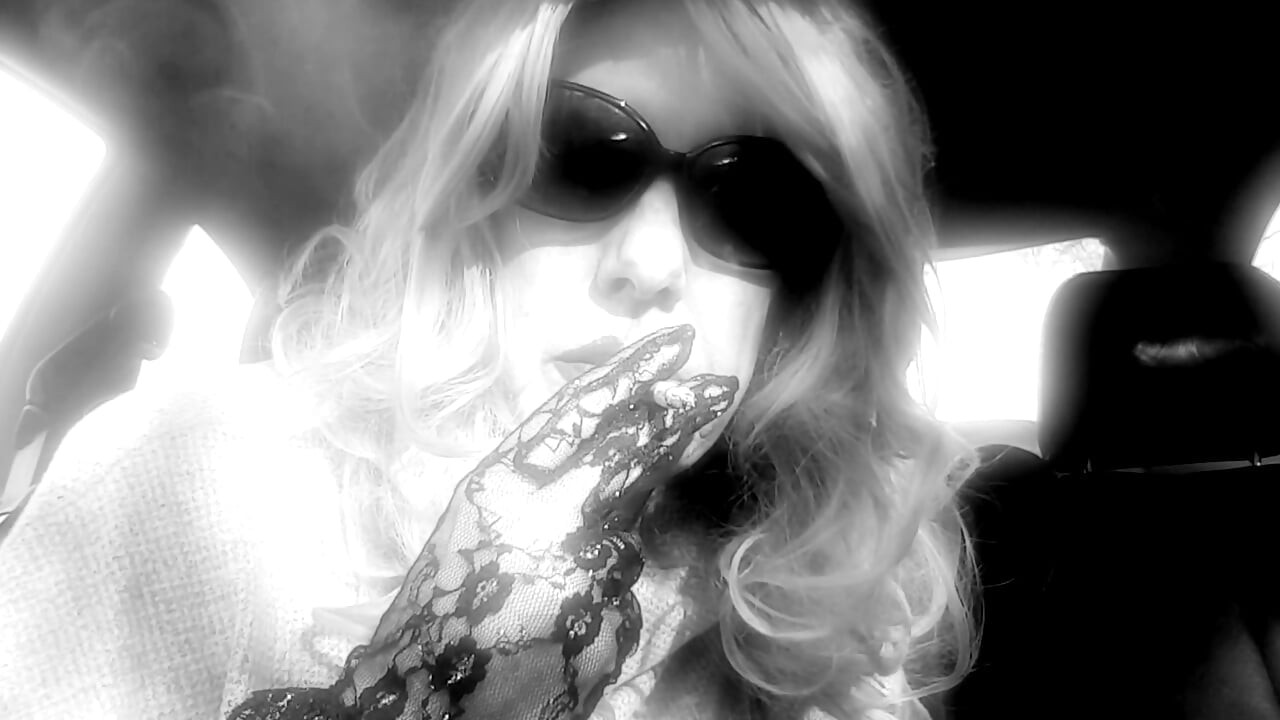 MRS. ROMAN SMOKING MARLBORO 100's IN HER CAR