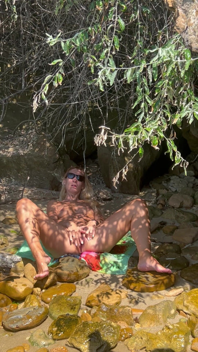 Masturbating on a nudist beach.