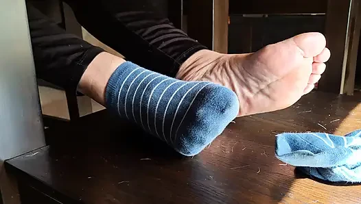 Playing with my girlfriends' feet under the table and removing her socks