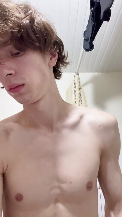Sexy boy taking a shower