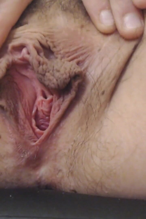 Gaping pussy lip spreading