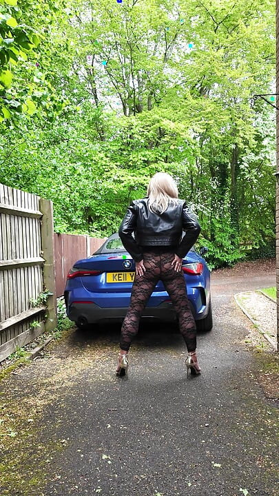 Crossdresser kellycd2022 in black leather jacket and lace catsuit and heels