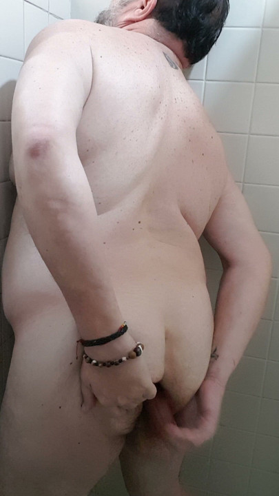 Playing with my dildo while I take a bath