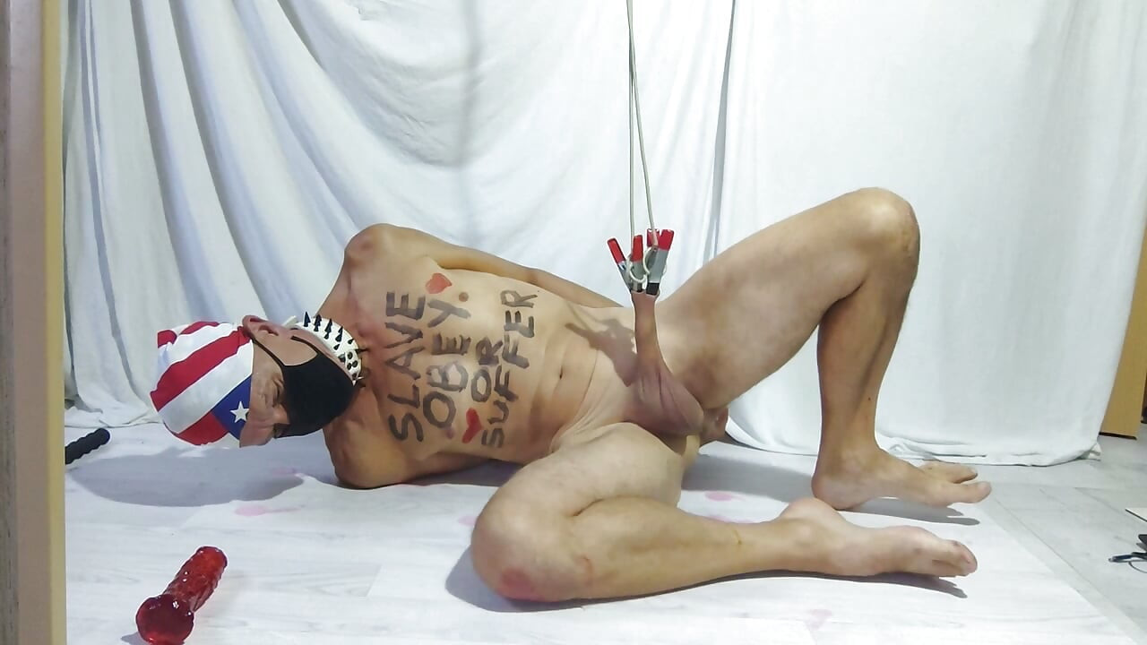 dirty gay slave pig handcuffed clamps on foreskin lying on slippery floor, dildo in ass, at the end cum shows how I liked it