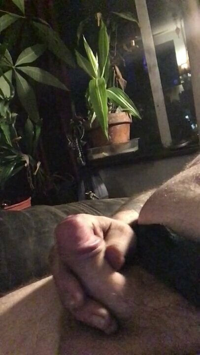 In chair enjoying the cock.