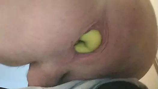 Pushing apple out of ass