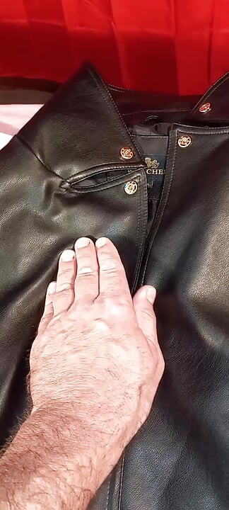 Ejaculating on the lining of her black leather coat