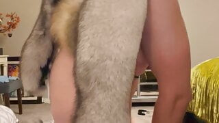 Fur slut tries on fur coats