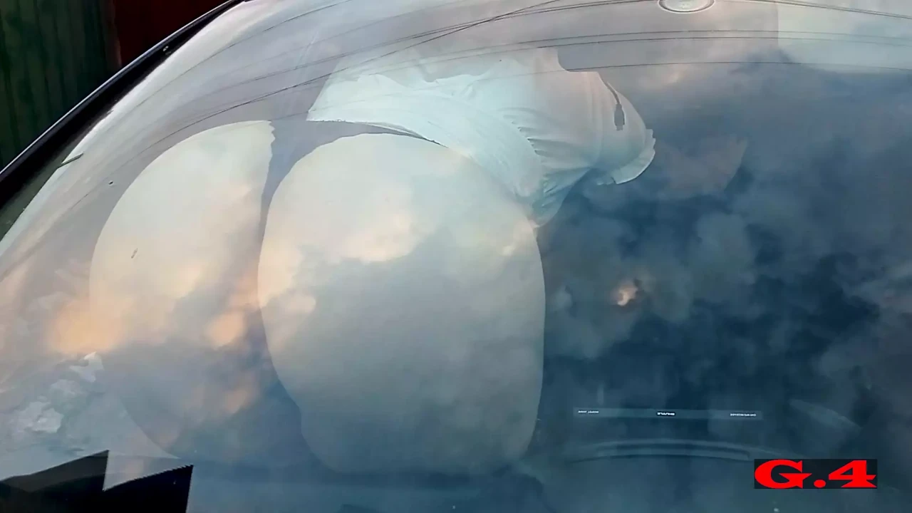 climbed into the car and started twirling her butt under the glass and accidentally pressed her foot on the windshield wipers