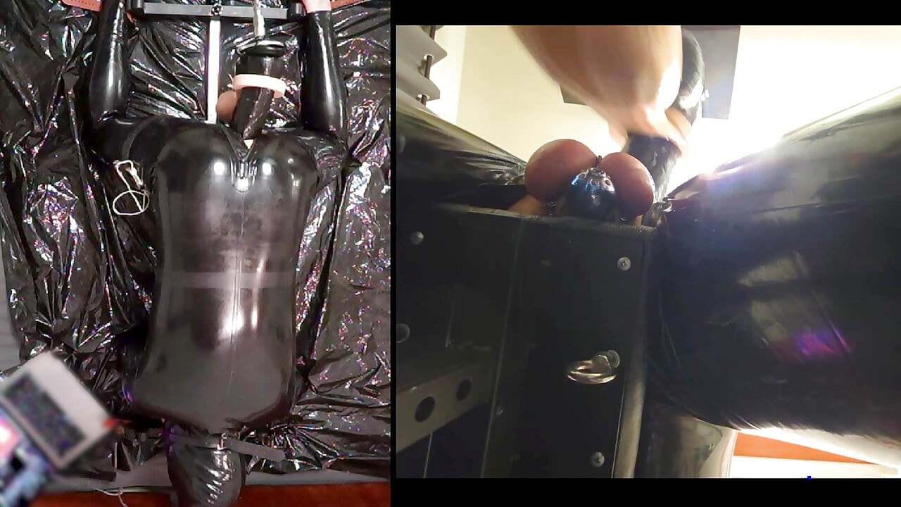 Session in the pillory with Latex Catsuit, PA Chastity, Giant Didildo and Estim